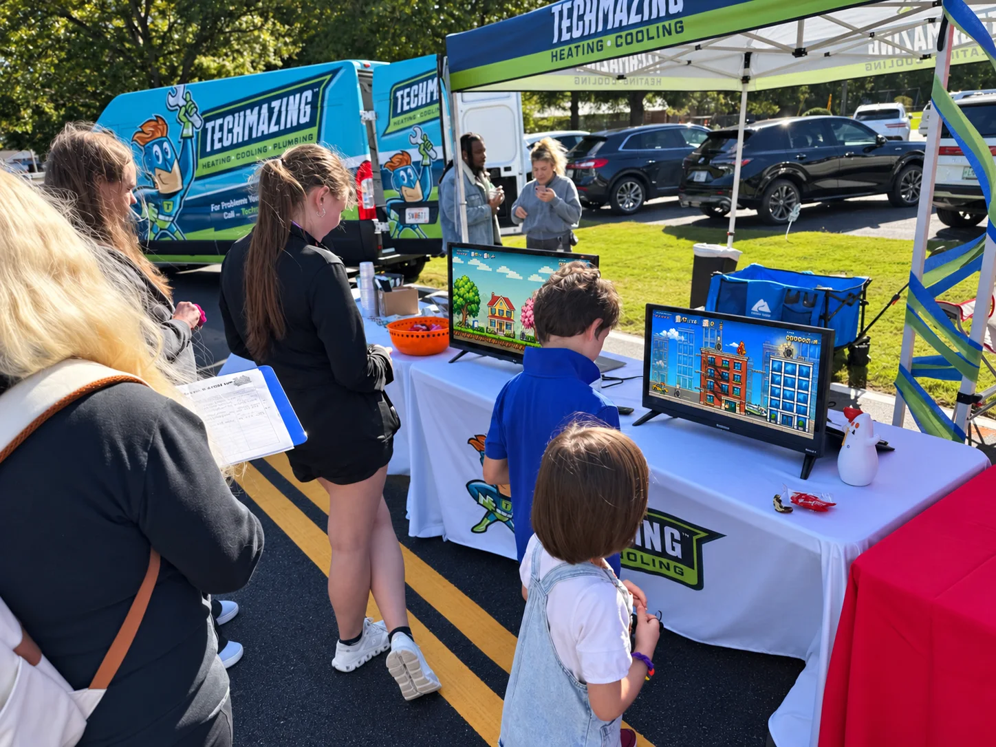 Families playing Techmazing’s branded game at AutumnFest in Loganville