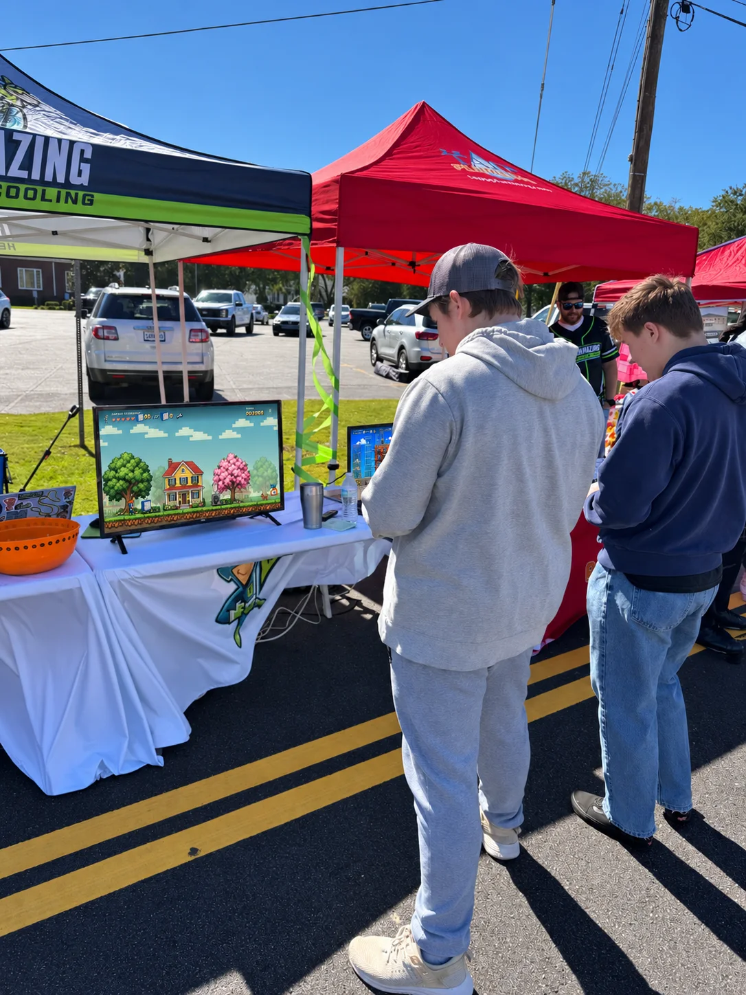 Two festival visitors try the game.